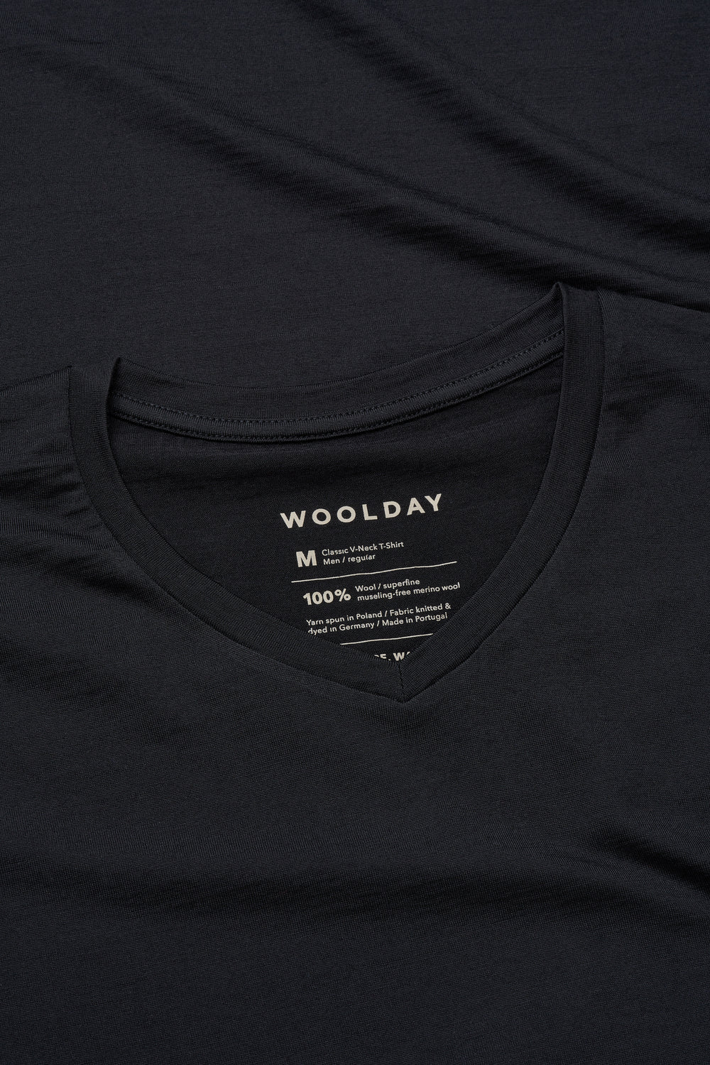 A clean, mid-depth V-neckline